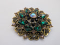 Emerald Medallion Statement Brooch — $25